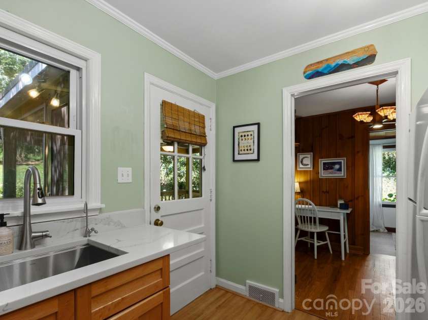 28 Arthur Road, Asheville, NC 28806.  MLS# CAR4418167, YatesRealty ID 47243. Kitchen Opens to Screened Porch