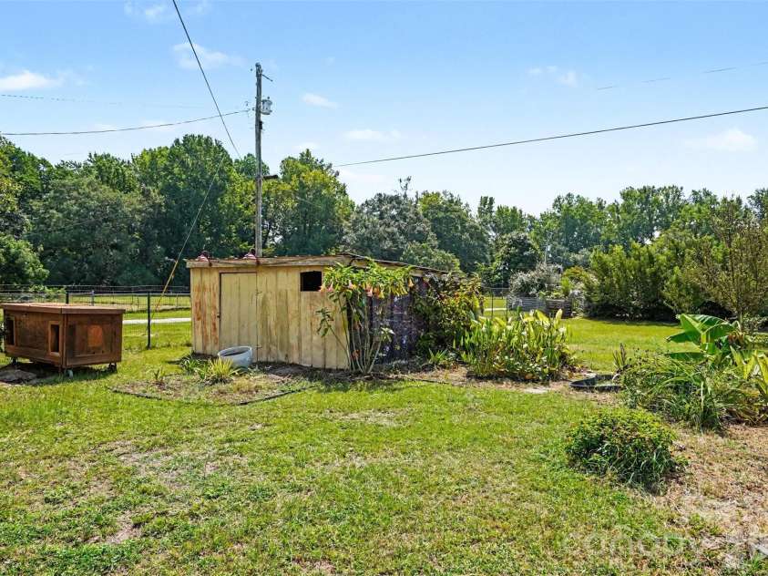 227 Cauthen Street, Heath Springs, SC 29058.  MLS# CAR4404918, YatesRealty ID 47275. Backyard and barn