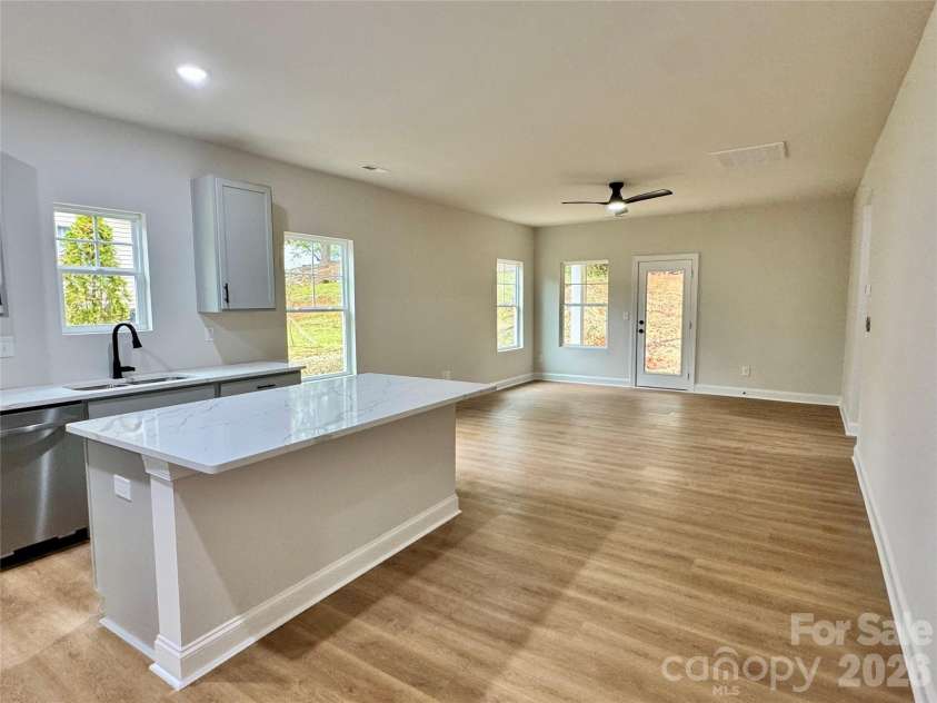 271 Melrose Drive, Concord, NC 28025.  MLS# CAR4413926, YatesRealty ID 47313. Kitchen to Living Room