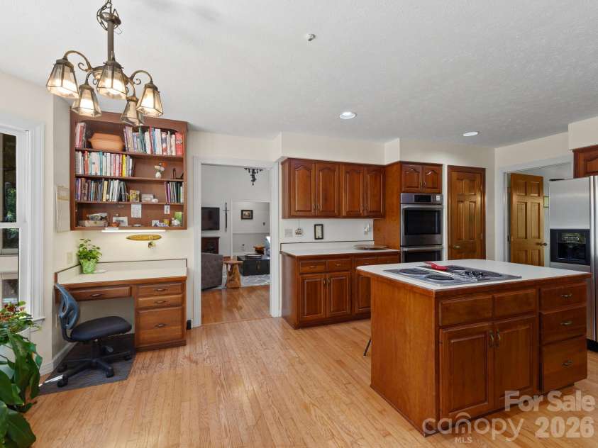 36 Windsong Drive, Fairview, NC 28730.  MLS# CAR4418309, YatesRealty ID 47314. Open kitchen with computer workstation
