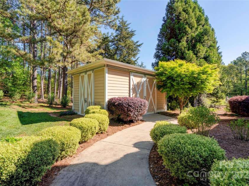 2929 Laura Road, Shelby, NC 28150.  MLS# CAR4127712, YatesRealty ID 4732. Side walk towards storage building