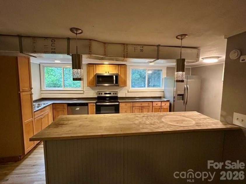 62 Kinard Lane, Penrose, NC 28766.  MLS# CAR4418956, YatesRealty ID 47323. Kitchen with Breakfast Bar