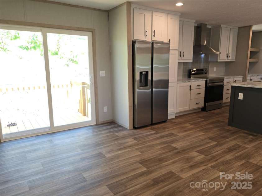 12 McGee Hill Road, Fairview, NC 28730.  MLS# CAR4234787, YatesRealty ID 4733. Dining area with outdoor deck access. 