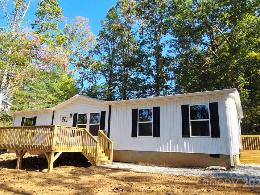 12 McGee Hill Road, Fairview, NC 28730.  MLS# CAR4234787, YatesRealty ID 4733. Front of home with large flat front yard. 