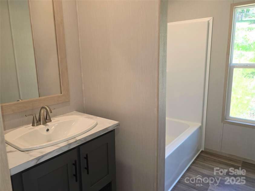 12 McGee Hill Road, Fairview, NC 28730.  MLS# CAR4234787, YatesRealty ID 4733. Guest bathroom. 