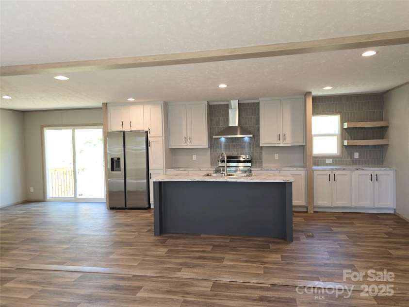 12 McGee Hill Road, Fairview, NC 28730.  MLS# CAR4234787, YatesRealty ID 4733. Large kitchen and dining space. 