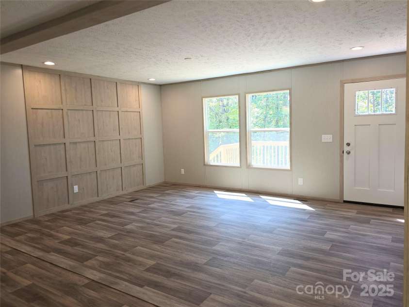 12 McGee Hill Road, Fairview, NC 28730.  MLS# CAR4234787, YatesRealty ID 4733. Large open living space.