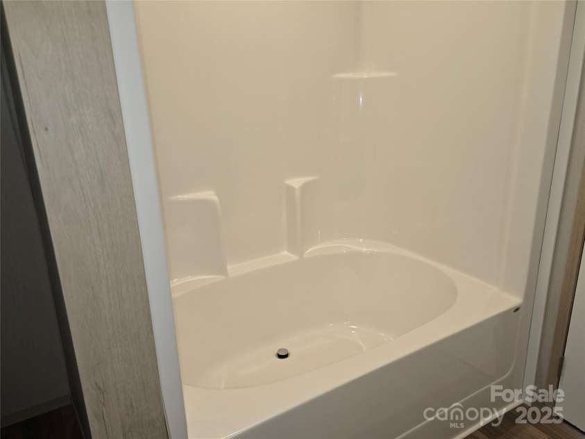 12 McGee Hill Road, Fairview, NC 28730.  MLS# CAR4234787, YatesRealty ID 4733. Large soaker tub in primary bathroom. 