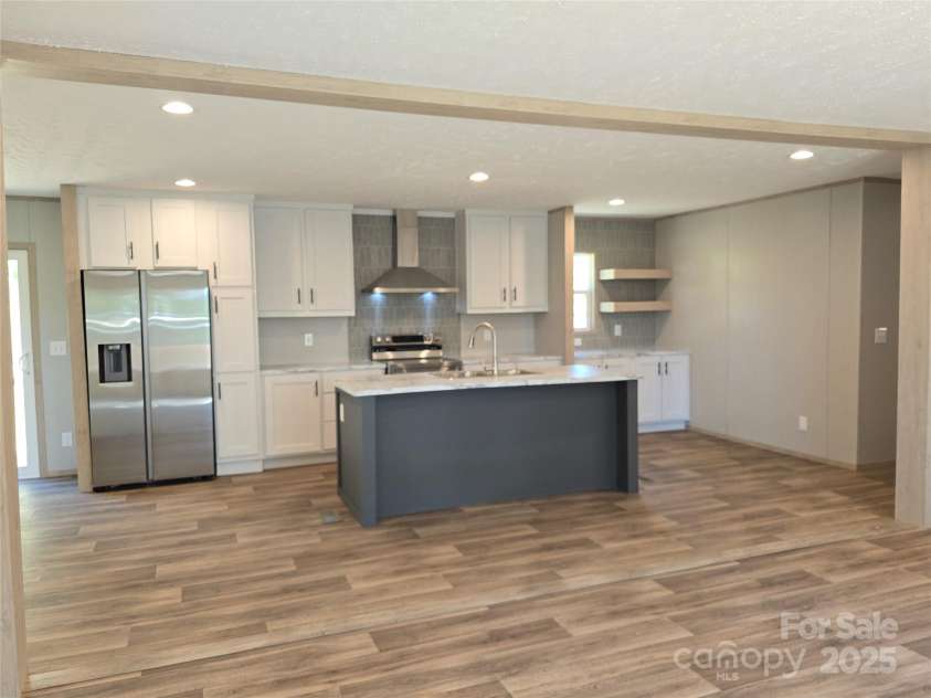 12 McGee Hill Road, Fairview, NC 28730.  MLS# CAR4234787, YatesRealty ID 4733. Living space opens into kitchen. 
