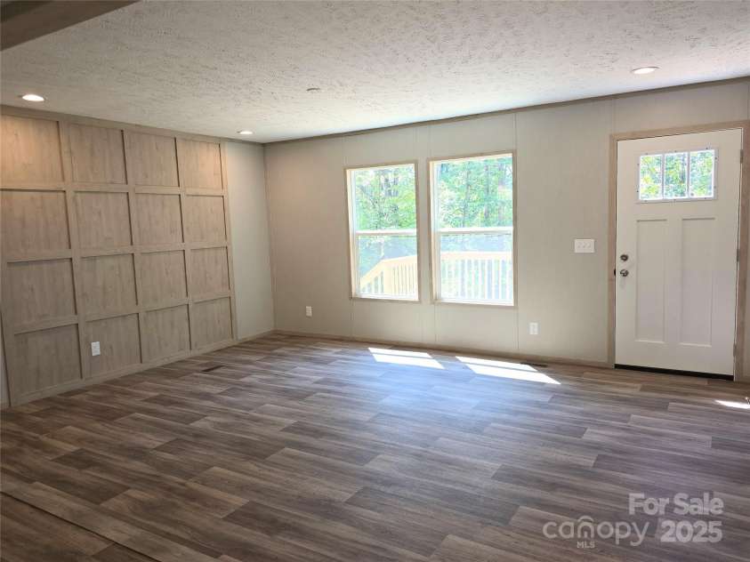 12 McGee Hill Road, Fairview, NC 28730.  MLS# CAR4234787, YatesRealty ID 4733. Open living space.