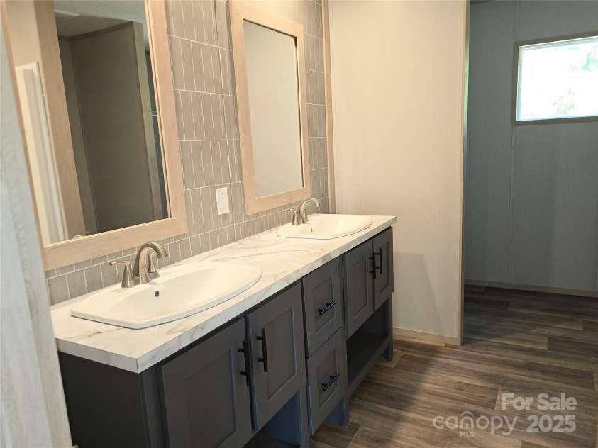 12 McGee Hill Road, Fairview, NC 28730.  MLS# CAR4234787, YatesRealty ID 4733. Primary bathroom with double vanity. 