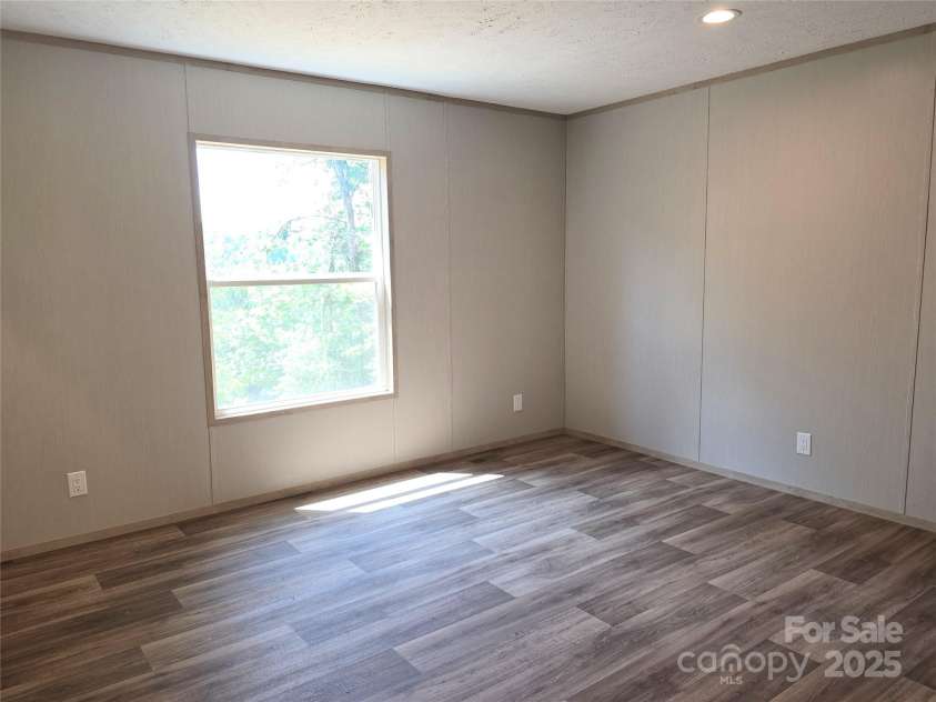 12 McGee Hill Road, Fairview, NC 28730.  MLS# CAR4234787, YatesRealty ID 4733. Spacious primary bedroom. 