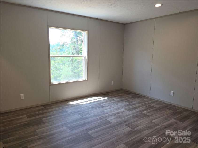 12 McGee Hill Road, Fairview, NC 28730.  MLS# CAR4234787, YatesRealty ID 4733. Spacious primary bedroom. 