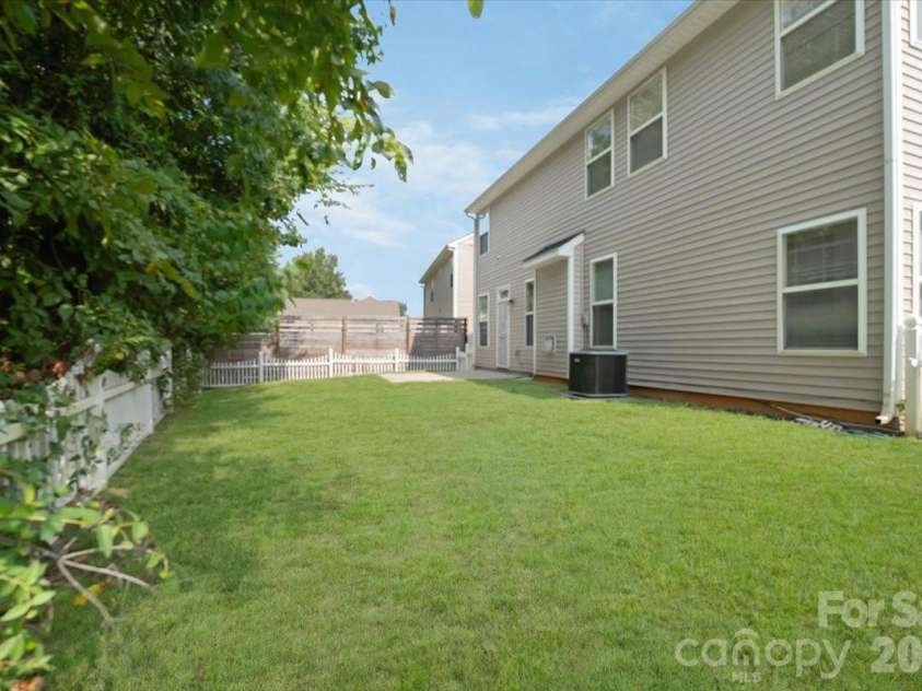 423 Mountain Quail Drive, Charlotte, NC 28216.  MLS# CAR4419011, YatesRealty ID 47334. Digitally Enhanced Lawn