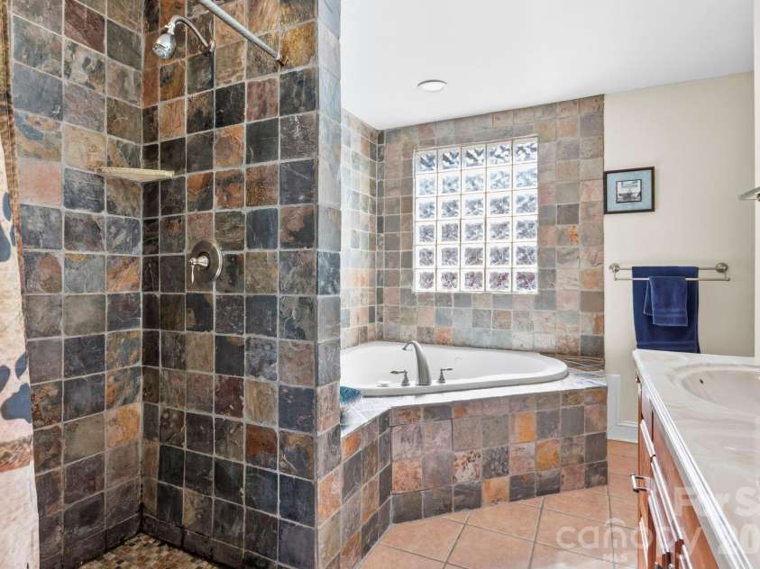 11 Roberts Drive, Swannanoa, NC 28778.  MLS# CAR4352970, YatesRealty ID 4734. Primary en-suite bathroom