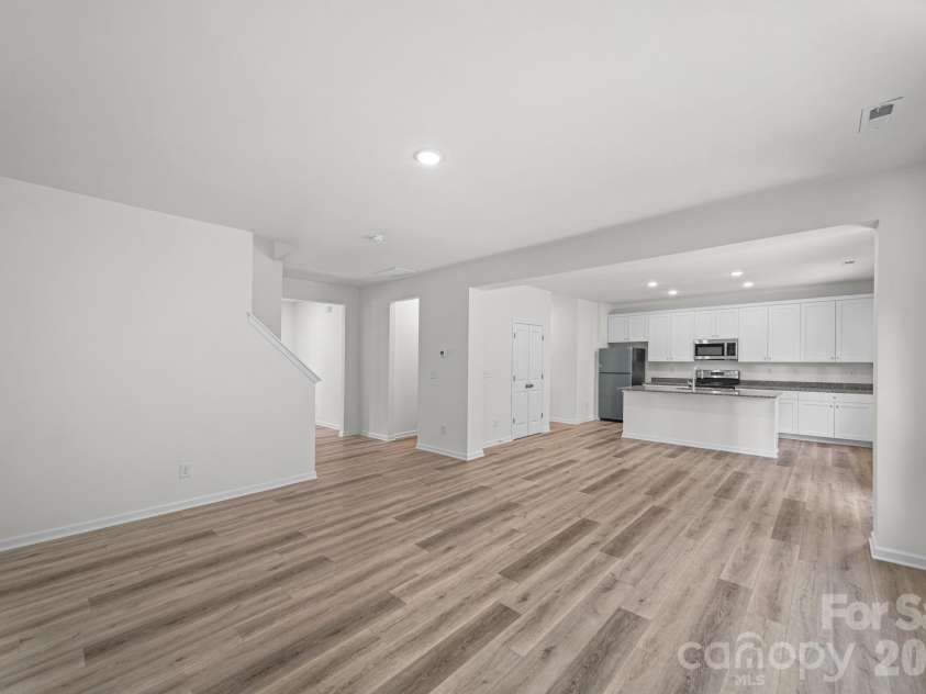 7725 Lane Drive, Charlotte, NC 28212.  MLS# CAR4395827, YatesRealty ID 47342. Great Room and Kitchen