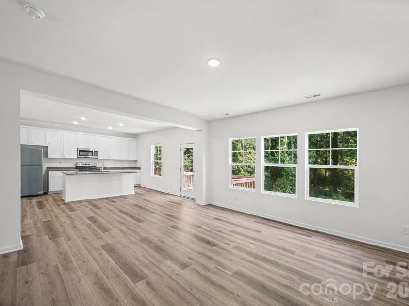 7725 Lane Drive, Charlotte, NC 28212.  MLS# CAR4395827, YatesRealty ID 47342. Great Room and Kitchen