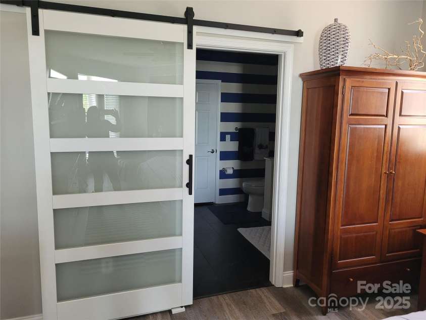 637 Williamson Road, Mooresville, NC 28117.  MLS# CAR4241846, YatesRealty ID 4736. Attractive Barn Door Accent in Primary BR/BA