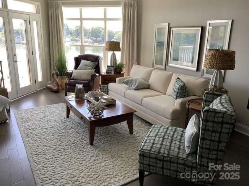 637 Williamson Road, Mooresville, NC 28117.  MLS# CAR4241846, YatesRealty ID 4736. Great Room with tons of natural light in this end unit condo with lots of windows!