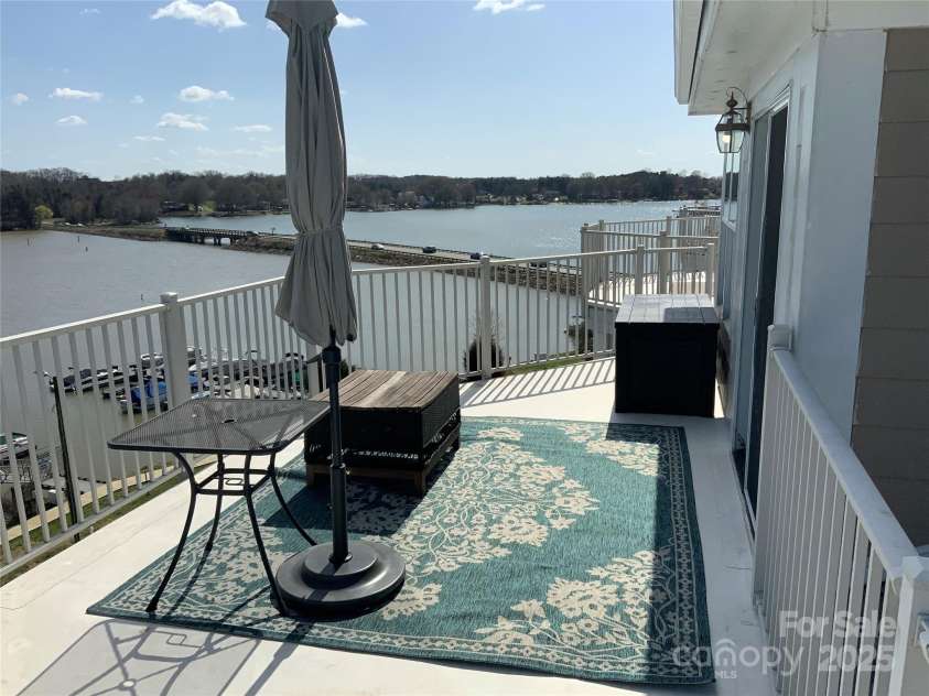 637 Williamson Road, Mooresville, NC 28117.  MLS# CAR4241846, YatesRealty ID 4736. Sun Deck off Upper Loft/Wine Room with views to die for!