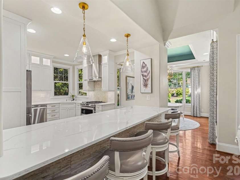 21253 Sandy Cove Road, Cornelius, NC 28031.  MLS# CAR4417192, YatesRealty ID 47365. Breakfast bar and pendant lighting
