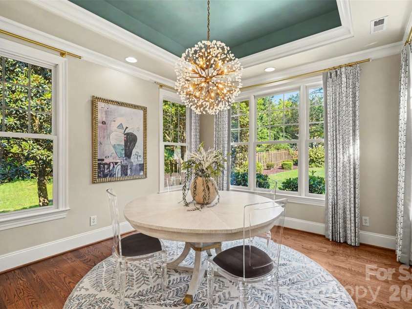21253 Sandy Cove Road, Cornelius, NC 28031.  MLS# CAR4417192, YatesRealty ID 47365. Dining room with tray ceiling and custom drapes