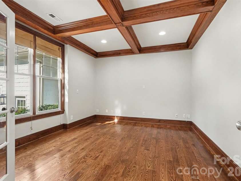 21253 Sandy Cove Road, Cornelius, NC 28031.  MLS# CAR4417192, YatesRealty ID 47365. Office with French doors and coffered ceiling