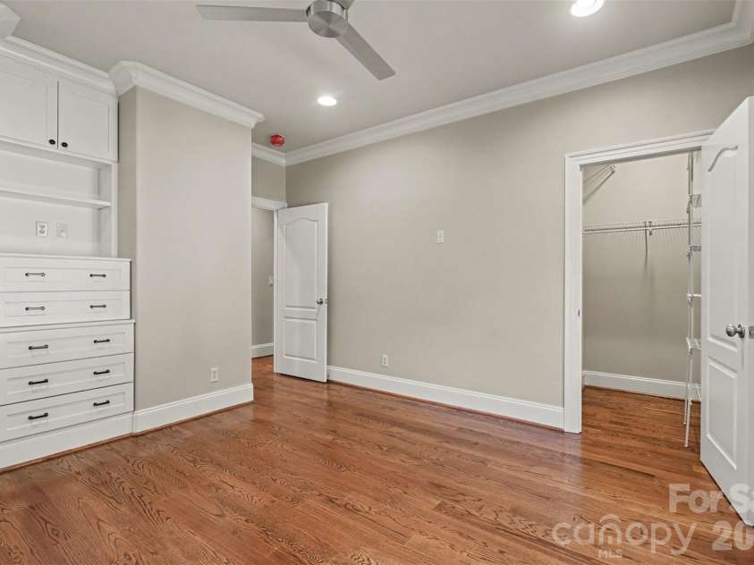 21253 Sandy Cove Road, Cornelius, NC 28031.  MLS# CAR4417192, YatesRealty ID 47365. Second bedroom on main with built ins and walk in closet