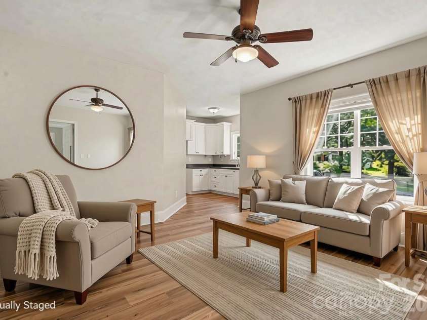 21253 Sandy Cove Road, Cornelius, NC 28031.  MLS# CAR4417192, YatesRealty ID 47365. Virtually staged living room