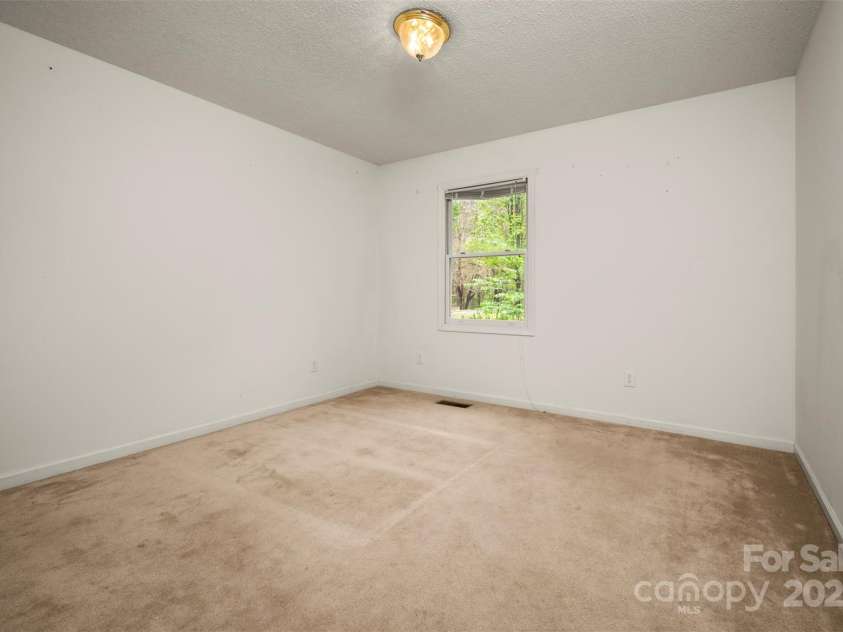 383 Woody Circle, Tryon, NC 28782.  MLS# CAR4242409, YatesRealty ID 4737. 