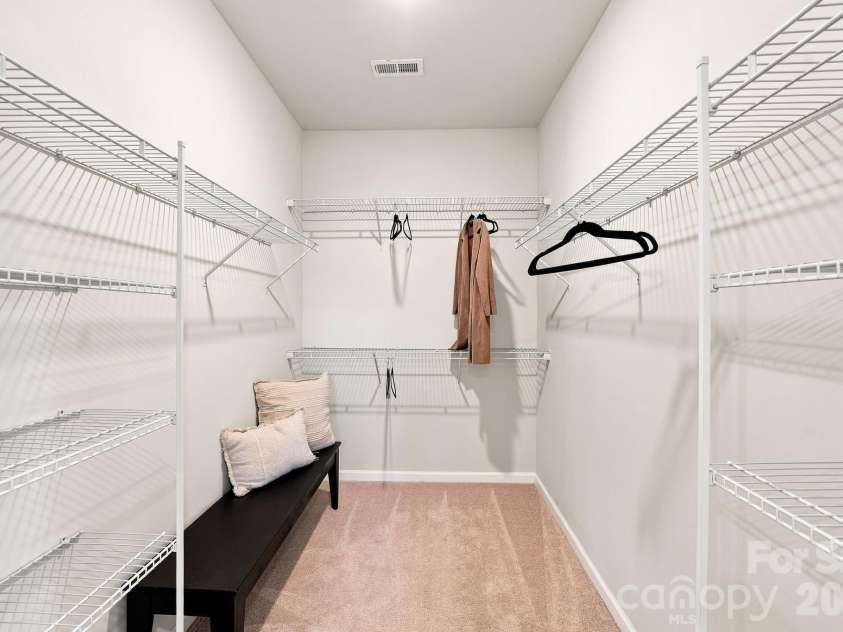 5930 Ardrey Kell Road, Charlotte, NC 28277.  MLS# CAR4418391, YatesRealty ID 47372. Large primary walk-in closet.
