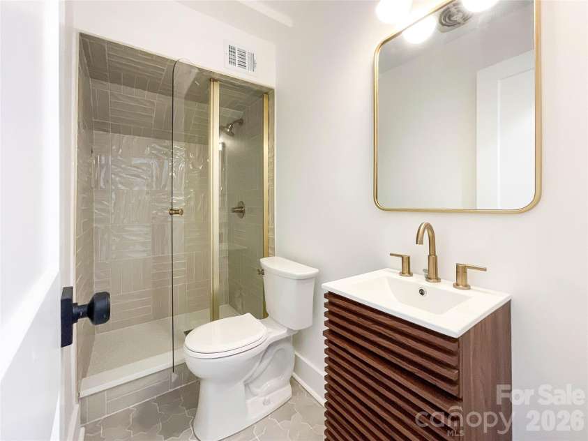 3011 Parkstone Drive, Charlotte, NC 28210.  MLS# CAR4418813, YatesRealty ID 47373. 3rd full bath - not the most space - but highly functional and cute as a button! - Really nice to have the extra full bath on the lower level