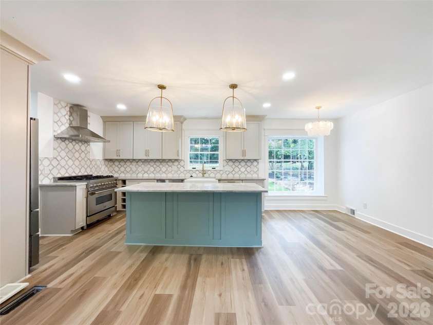 3011 Parkstone Drive, Charlotte, NC 28210.  MLS# CAR4418813, YatesRealty ID 47373. Classic lines and spacing - the large windows that we intestinally saved invite the backyard indoors - not shown is the adjacent Mudroom with food pantry, cabinetry, and wine fridge option