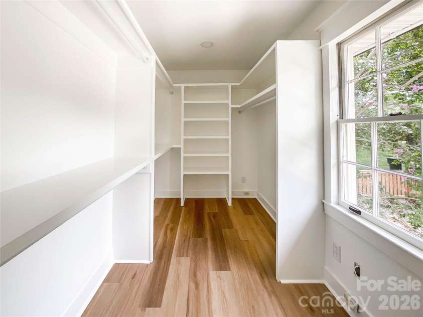 3011 Parkstone Drive, Charlotte, NC 28210.  MLS# CAR4418813, YatesRealty ID 47373. Custom built in primary closet - also offering natural light
