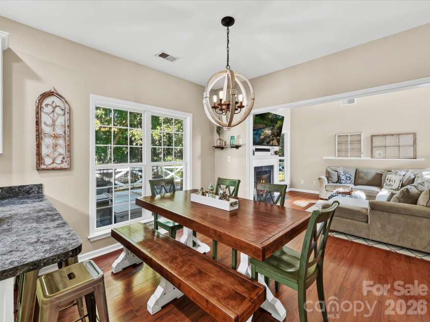150 Cavendish Drive, Mooresville, NC 28115.  MLS# CAR4416863, YatesRealty ID 47420. Bright dining area featuring oversized windows with peaceful backyard views, and an open connection to the kitchen and Great Room.