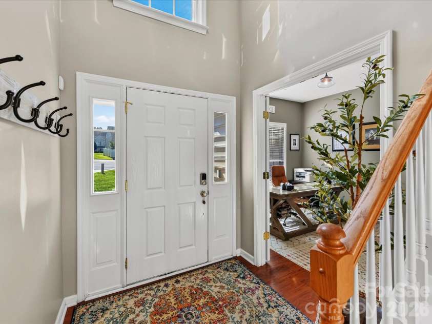 150 Cavendish Drive, Mooresville, NC 28115.  MLS# CAR4416863, YatesRealty ID 47420. Bright, welcoming foyer featuring soaring ceilings, abundant natural light, beautiful flooring and easy access to the adjoining home office.