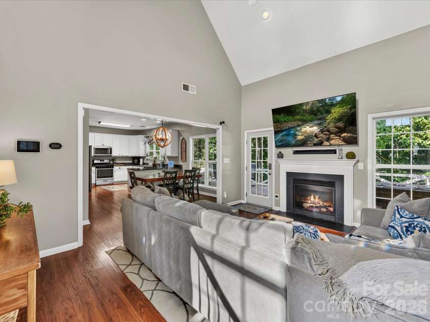 150 Cavendish Drive, Mooresville, NC 28115.  MLS# CAR4416863, YatesRealty ID 47420. Spacious Great Room featuring soaring ceilings, a cozy fireplace, abundant natural light, and an open flow to the kitchen and dining area.