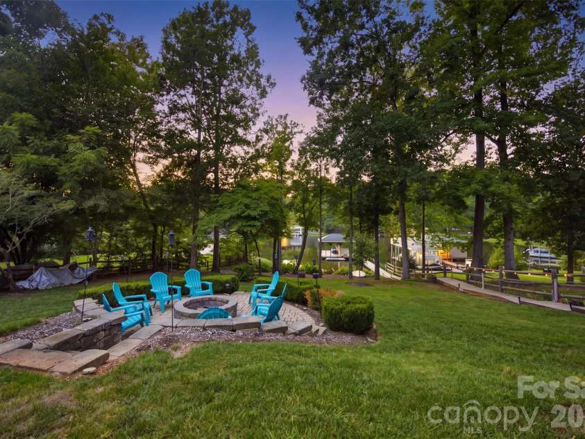 116 Canoe Court, Mount Gilead, NC 27306.  MLS# CAR4416877, YatesRealty ID 47426. Fire pit over looking the water