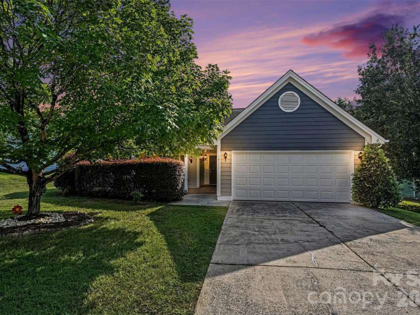 10117 Crayton Drive, Charlotte, NC 28269.  MLS# CAR4415978, YatesRealty ID 47431. Front exterior at twilight.