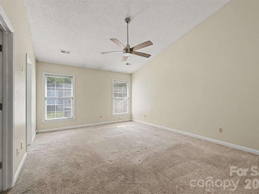 10117 Crayton Drive, Charlotte, NC 28269.  MLS# CAR4415978, YatesRealty ID 47431. Primary bedroom with vaulted ceiling.