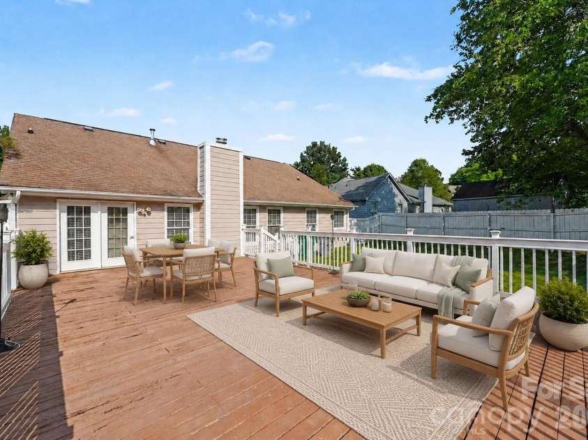 10117 Crayton Drive, Charlotte, NC 28269.  MLS# CAR4415978, YatesRealty ID 47431. Rear deck — virtually staged.
