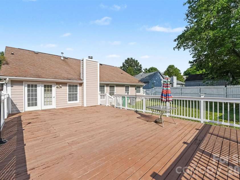 10117 Crayton Drive, Charlotte, NC 28269.  MLS# CAR4415978, YatesRealty ID 47431. Spacious rear deck overlooking the fenced backyard.