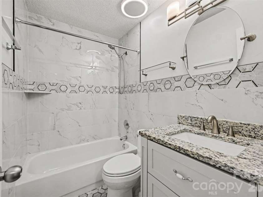 10117 Crayton Drive, Charlotte, NC 28269.  MLS# CAR4415978, YatesRealty ID 47431. Updated secondary bathroom.