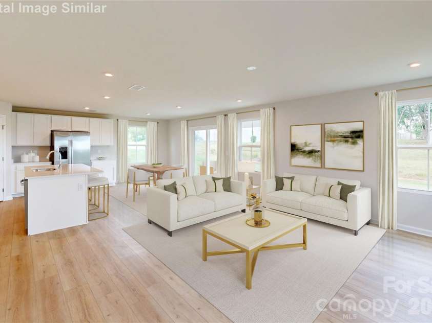 131 Auburn Hills Drive, Albemarle, NC 28001.  MLS# CAR4416520, YatesRealty ID 47445. Flooded with natural light from large windows, this cozy open-concept space flows effortlessly from the kitchen to the dining area. Whether hosting friends or enjoying quiet family time, the airy layout creates the 
