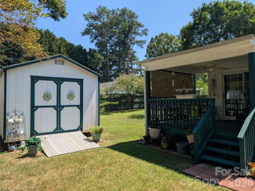 406 Kimmons Street, Landis, NC 28088.  MLS# CAR4416117, YatesRealty ID 47447. Exterior Storage Building and Covered Deck