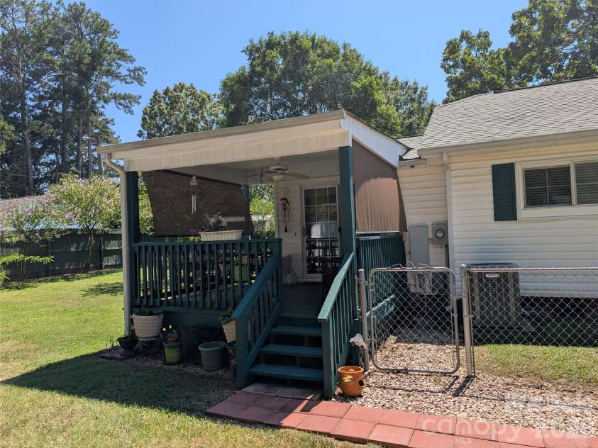 406 Kimmons Street, Landis, NC 28088.  MLS# CAR4416117, YatesRealty ID 47447. Side Covered Deck