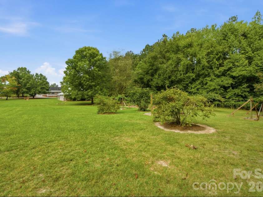 3201 Gilboa Road, Wingate, NC 28174.  MLS# CAR4415181, YatesRealty ID 47454. Fig tree and room for more!