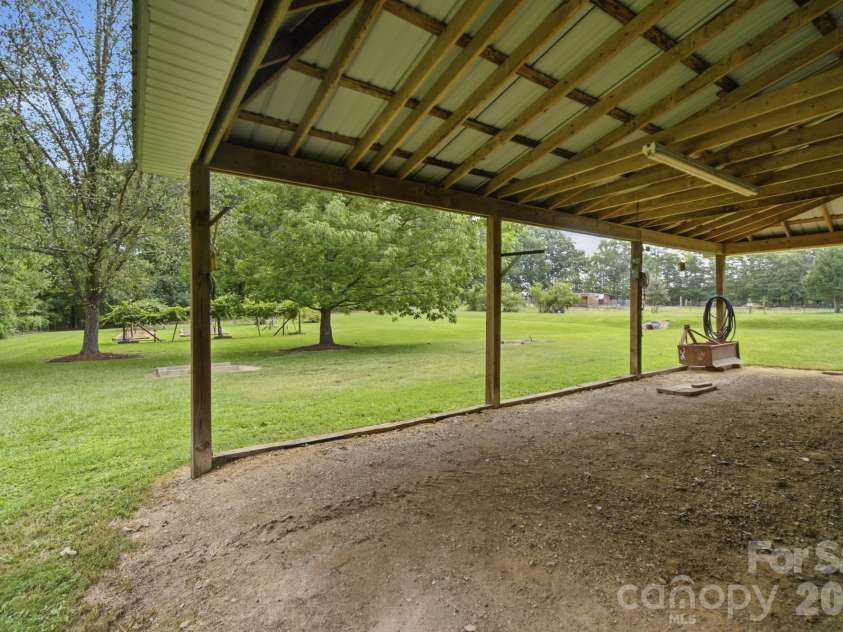 3201 Gilboa Road, Wingate, NC 28174.  MLS# CAR4415181, YatesRealty ID 47454. Lean-to for storage, boat, tractor, trailer