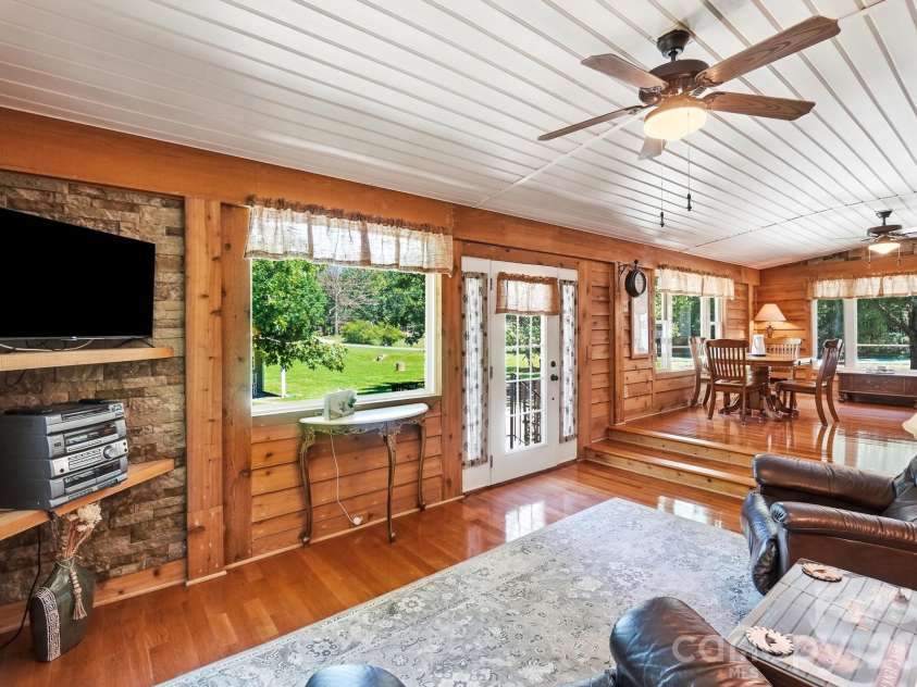 3201 Gilboa Road, Wingate, NC 28174.  MLS# CAR4415181, YatesRealty ID 47454. Lodge inspired sunroom
