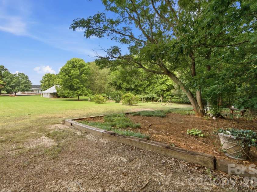 3201 Gilboa Road, Wingate, NC 28174.  MLS# CAR4415181, YatesRealty ID 47454. Planter boxes throughout the property